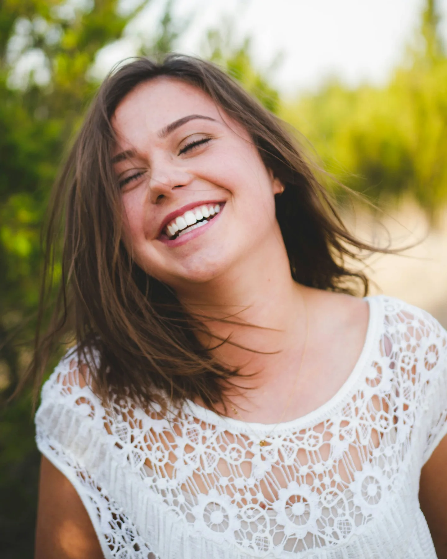 Person with a natural smile representing individualized cosmetic dentistry