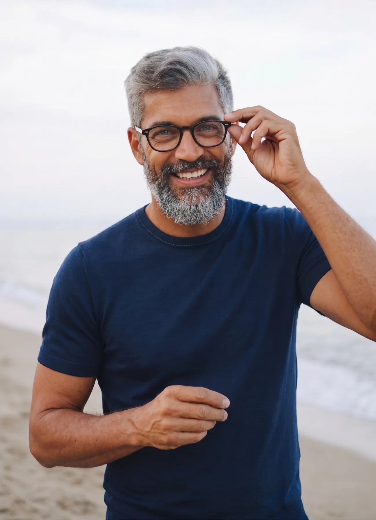 Smiling denture patient enjoying the Orange County coast